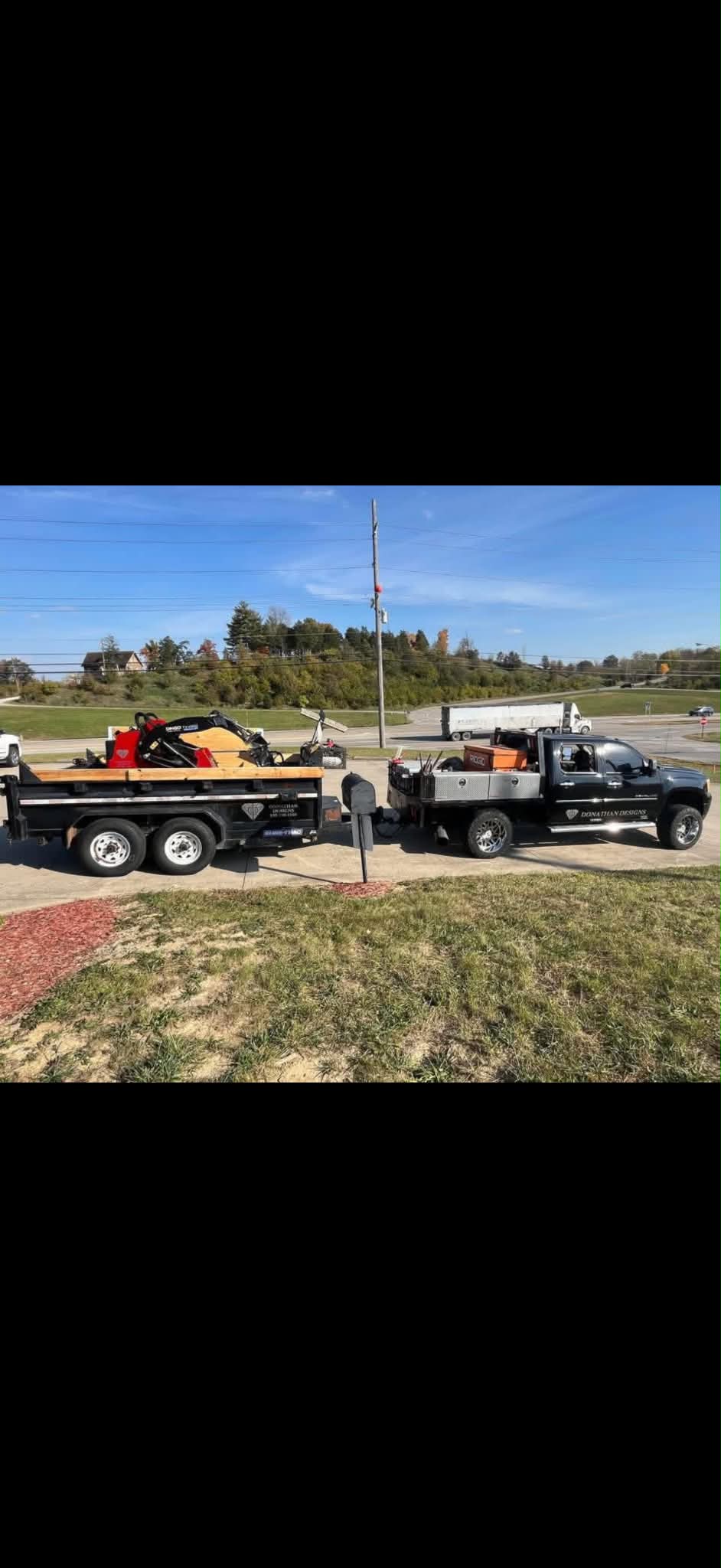 Donathan Designs truck and dump trailer loaded with equipment, ready to roll